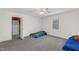 Bedroom featuring carpeted floor, window, ceiling fan, and closet at 6709 Windchase Dr, Rocky Mount, NC 27803