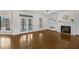 Bright living room with a fireplace, built-in shelving, and access to the deck at 6709 Windchase Dr, Rocky Mount, NC 27803