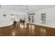 Open-concept living area featuring hardwood floors, a breakfast bar, and a dining space at 6709 Windchase Dr, Rocky Mount, NC 27803