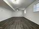 Spacious finished basement with ceiling fan, recessed lighting, and dark wood-look flooring at 7780 Brookdale Dr, Raleigh, NC 27616