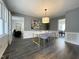 Open-concept dining area with modern furniture and stylish decor at 7780 Brookdale Dr, Raleigh, NC 27616
