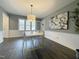 Bright dining room with contemporary table, chairs, and modern artwork at 7780 Brookdale Dr, Raleigh, NC 27616
