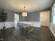 Dining room with modern table, stylish chairs, and ample natural light at 7780 Brookdale Dr, Raleigh, NC 27616