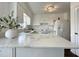 Bright kitchen featuring white cabinets, granite countertops, and stainless steel appliances at 7780 Brookdale Dr, Raleigh, NC 27616