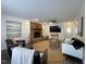 Well-lit living room features fireplace, TV, ceiling fan, and cozy seating arrangement at 7780 Brookdale Dr, Raleigh, NC 27616