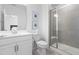 Bathroom featuring a white vanity, toilet, glass-enclosed shower showcasing modern fixtures and clean lines at 8401 Zinc Autumn Path Path, Raleigh, NC 27615