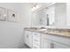 Bright bathroom features double sinks and framed mirrors at 8401 Zinc Autumn Path Path, Raleigh, NC 27615