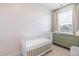 Cozy Bedroom with a white crib and green dresser at 8401 Zinc Autumn Path Path, Raleigh, NC 27615