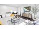 Bright living room with a comfortable sofa, modern decor, and a mounted TV for entertainment at 8401 Zinc Autumn Path Path, Raleigh, NC 27615