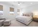 Bright bedroom with ceiling fan and comfortable sitting area at 8401 Zinc Autumn Path Path, Raleigh, NC 27615