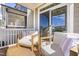Relaxing outdoor patio features comfortable white cushioned chairs, offering a great spot for unwinding at 8401 Zinc Autumn Path Path, Raleigh, NC 27615