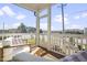 Serene screened in porch provides a peaceful view with comfortable seating and a charming, airy atmosphere at 8401 Zinc Autumn Path Path, Raleigh, NC 27615
