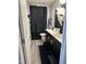 Well-appointed bathroom with a black vanity, neutral walls, and stylish decor at 94 Aylebury Rdg, Zebulon, NC 27597