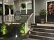 Well-lit front porch with comfy chairs, hanging plants, and a charming 'Blessed' sign at 94 Aylebury Rdg, Zebulon, NC 27597