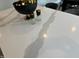 Close-up of a quartz kitchen island countertop with stylish decor at 94 Aylebury Rdg, Zebulon, NC 27597