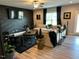 Modern living room with stylish decor, a large comfortable sectional, and an accent wall at 94 Aylebury Rdg, Zebulon, NC 27597