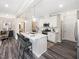 Bright kitchen with a quartz island with barstool seating and stainless appliances at 1008 Sora Way, Durham, NC 27703
