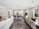 Open concept living space showcasing a kitchen island, dining area, and inviting living room at 1008 Sora Way, Durham, NC 27703