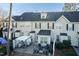 An aerial view of the outdoor patio featuring comfortable seating arrangements and shade at 10115 Mizner Ln, Raleigh, NC 27617
