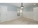 Bright bedroom with panel molding, a neutral color scheme, and natural light from a large window at 10115 Mizner Ln, Raleigh, NC 27617