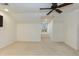 Well-lit bonus room with carpet, ceiling fan, and window for natural light at 10115 Mizner Ln, Raleigh, NC 27617
