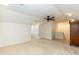 Bright bonus room with carpet, ceiling fan, and ample space for living and relaxing at 10115 Mizner Ln, Raleigh, NC 27617