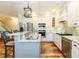 Updated kitchen features granite countertops, stainless steel appliances, and custom cabinetry for a gourmet experience at 10115 Mizner Ln, Raleigh, NC 27617