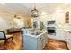 Charming kitchen featuring a gray island, stainless steel appliances, and an open design leading to the living area at 10115 Mizner Ln, Raleigh, NC 27617