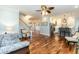 Spacious open-concept living area with hardwood floors seamlessly connecting to the kitchen and dining spaces at 10115 Mizner Ln, Raleigh, NC 27617