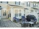 Private patio with outdoor seating and a grill, perfect for relaxation and entertaining at 10115 Mizner Ln, Raleigh, NC 27617