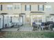 Private patio with outdoor seating and a pergola, perfect for relaxation and entertaining at 10115 Mizner Ln, Raleigh, NC 27617