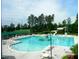 Community pool featuring a large swimming area, slide, and ample seating for residents and guests at 10115 Mizner Ln, Raleigh, NC 27617