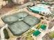 Aerial view of tennis courts and amenity area with covered gazebos at 10115 Mizner Ln, Raleigh, NC 27617