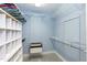 Spacious walk-in closet with ample shelving and storage space, offering organization and convenience at 10115 Mizner Ln, Raleigh, NC 27617