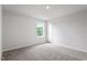 Bright bedroom with neutral carpet and a sun-filled window with views of the outdoors at 108 Grove Township Way, Angier, NC 27501