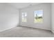 Bright bedroom with two windows providing an abundance of natural light at 108 Grove Township Way, Angier, NC 27501