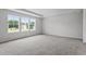 Large bedroom with neutral carpet and large windows providing natural light at 108 Grove Township Way, Angier, NC 27501