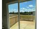 View from new deck overlooking green field and trees in a new development at 108 Grove Township Way, Angier, NC 27501