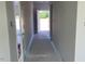 Neutral hallway showcasing freshly painted walls with doors and trim ready for the final touches at 108 Grove Township Way, Angier, NC 27501