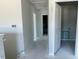Hallway showcasing modern doors with sleek hardware and fresh, neutral paint, awaits final accents at 108 Grove Township Way, Angier, NC 27501