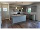 Kitchen with stainless steel appliances, granite countertops, and kitchen island at 108 Grove Township Way, Angier, NC 27501