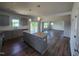 Kitchen with granite countertops and island, stainless steel appliances, and wood flooring at 108 Grove Township Way, Angier, NC 27501