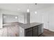 Stylish kitchen island with granite countertop and ample storage space at 108 Grove Township Way, Angier, NC 27501
