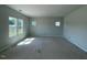 Bright living room with large windows offering ample natural light, ready for personalization and decor at 108 Grove Township Way, Angier, NC 27501