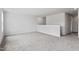 Upstairs loft area with neutral carpet and view of second level at 108 Grove Township Way, Angier, NC 27501