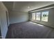 Large main bedroom with carpet flooring and windows offering natural light at 108 Grove Township Way, Angier, NC 27501