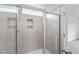 Tiled shower with glass doors and recessed niche for storage at 108 Grove Township Way, Angier, NC 27501
