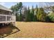 Backyard with lawn featuring mature trees at 1137 Fanning Dr, Wake Forest, NC 27587