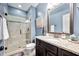 Stylish bathroom with glass enclosed shower, granite vanity top and modern fixtures at 1137 Fanning Dr, Wake Forest, NC 27587