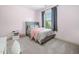 Bright bedroom with a large window and a cozy bed, perfect for relaxation and restful nights at 1137 Fanning Dr, Wake Forest, NC 27587